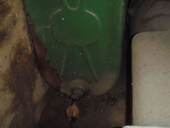 This abandoned, rusted oil tank in the basement will be expensive to remove.