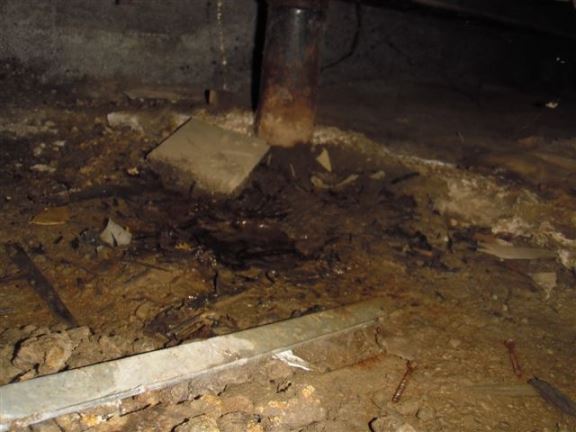 This shows water in a crawl space from an improper air conditioner drain.