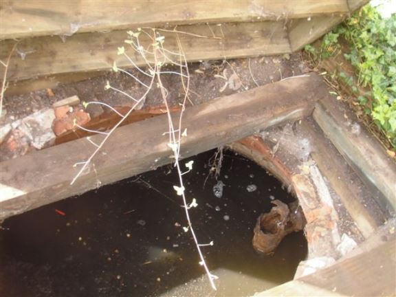 This round brick septic tank on an old rural property was still in use.