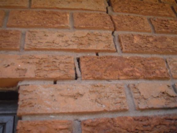 This is a typical crack in the bricks near a garage door.