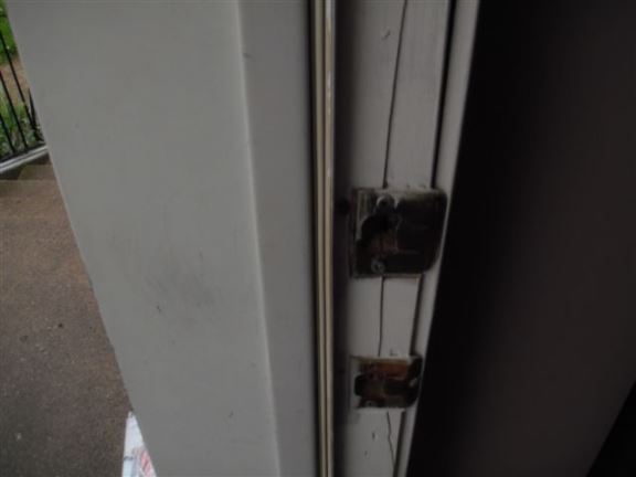 This front door jamb was split, apparently this happened during a break-in.