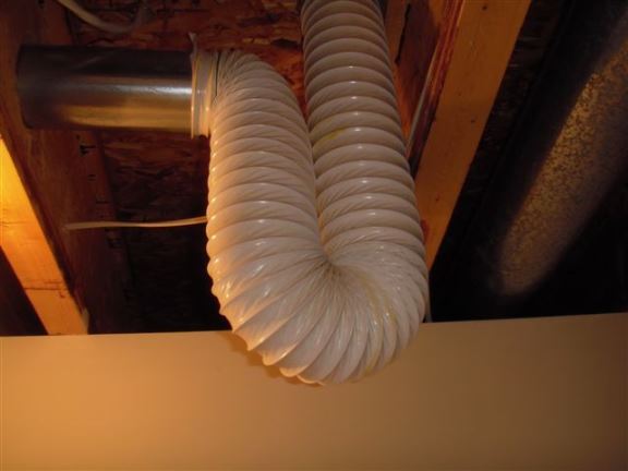 The dryer vent should always be solid metal, and this one also has a loop which will trap moisture.