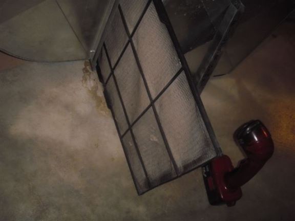 This furnace filter is completely clogged and could result in furnace over-heating.