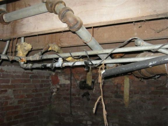 Here we see more galvanized water pipes; many insurance companies will not insure houses with galvanized pipes because they are prone to rusting and leaks.