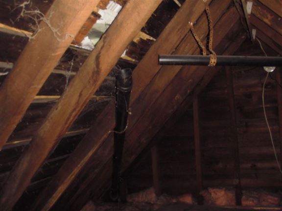 These plumbing vents are not terminated to the outside, so toxic fumes and moisture are being released into the attic.