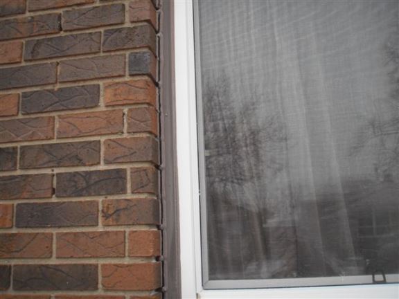 Window and door caulking is required on this house to reduce heating costs and prevent water leakage.