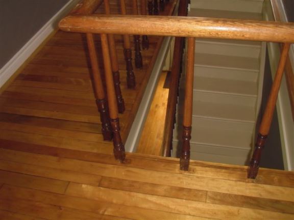 This photo shows that the stair spindle spaces that are too wide for toddlers  a very dangerous situation.