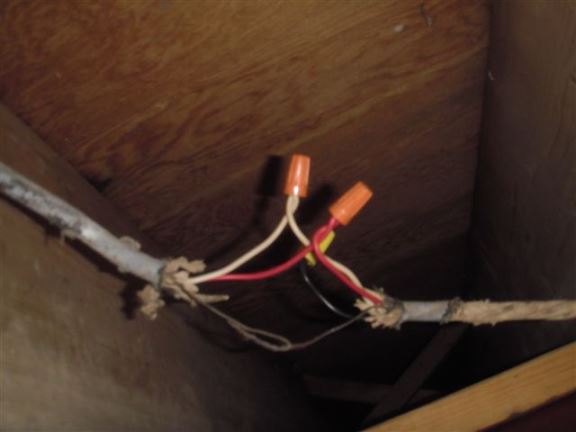 No junction box was used for this connection. This would never pass an inspection since wire connections should never be exposed.