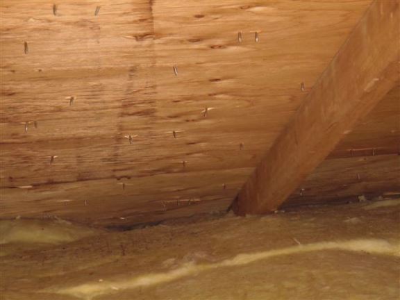 The attic venting is obstructed at the eaves by insulation. This will cause moisture to be trapped, resulting in mold and rot.