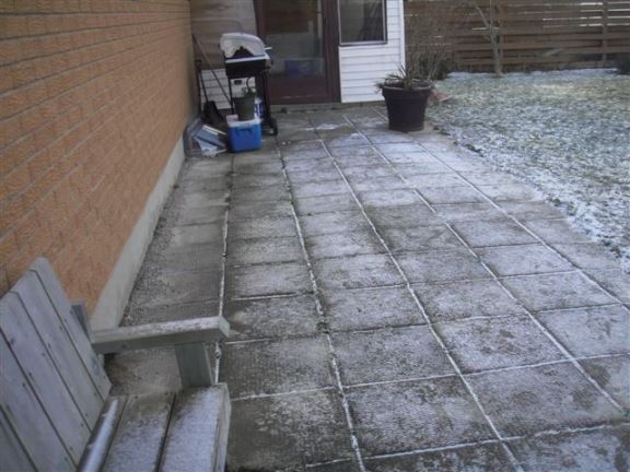 This patio is sloping towards the house, causing basement seepage issues.