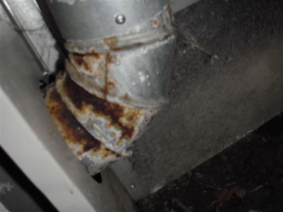 This rusted furnace exhaust pipe will eventually rust through, allowing carbon monoxide into the house.