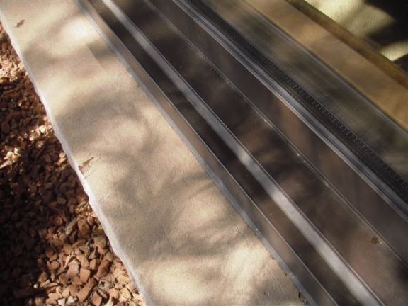 These window sills slope backwards, so rain water does not shed as it should.